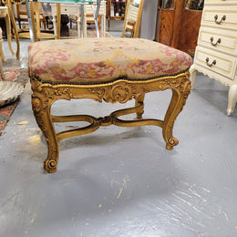 Charming 19th Century gilt wood tapestry covered Louis XV style stool. It has a beautifully carved base and undercarriage and it has been sourced from France. It is in good original detailed condition, please view photos of tapestry has they help form part of the description.