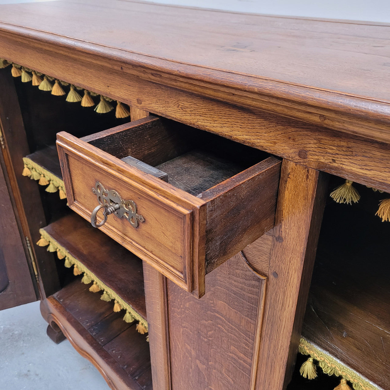 Amazing French Oak early 19th Century two door sideboard with one drawer and two fixed shelves. Sourced from France and in good original detailed condition.