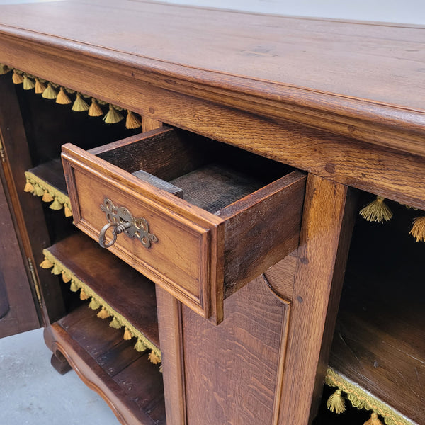 Amazing French Oak early 19th Century two door sideboard with one drawer and two fixed shelves. Sourced from France and in good original detailed condition.