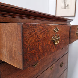 Early 19th Century English Oak chest on stand. It has been sourced in France and has plenty of storage space with eight drawers. In good original detailed condition.