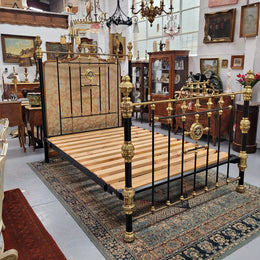 Rare Antique cast iron and brass Victorian queen size bed. Comes with custom made slats.  It has been sourced locally and is in good original condition.