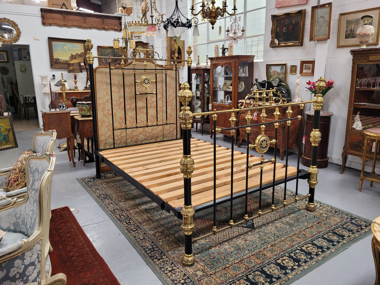 Rare Antique cast iron and brass Victorian queen size bed. Comes with custom made slats.  It has been sourced locally and is in good original condition.