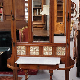 Late Victorian Arts and Crafts style marble top hall stand. Features three attractive tiles, original hooks and single drawer. In good original condition.