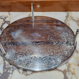 Five Strachan and two Rodd silver plate table coasters in a silver plate stand. In good original detailed condition.