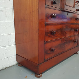 Victorian Flame Mahogany chest of eight drawers. Wooden handles with inlaid mother of pearl, hat drawer has key and lock that works. In good original condition, all drawers run smoothly.