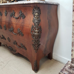 A Grand French Louis XV Style Flame Mahogany Commode