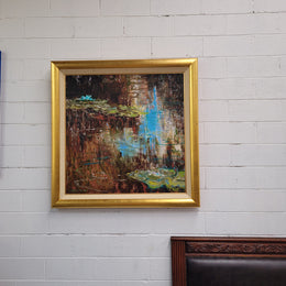 A beautiful Framed oil on canvas in vibrant colours and framed in a lovely gold frame. This piece is signed by artist John Cumming from "The Mill Gallery" and still has its original gallery card as shown in picture. It is in good original condition.