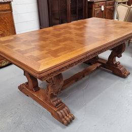 Amazing French Oak Renaissance style parquetry top extension table. Beautiful parquetry top and amazing detailed carvings on the legs. It extends to 306 cm long when fully extended. Sourced from France and in good original detailed condition.