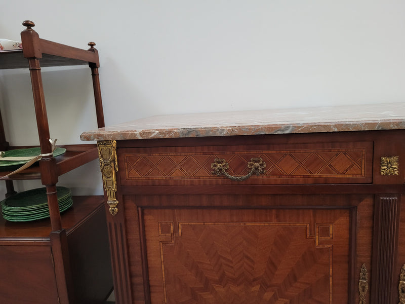 Louis 16th style Mahogany marble top cupboard and two drawers with decorative marquetry inlay and gilt bronze mounts. In good original detailed condition.