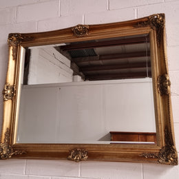 Decorative Vintage gilt bevelled mirror. In good original detailed condition.