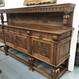 French Oak beautifully carved Renaissance style sideboard with four drawers. Beautiful wax finish and is in good original detailed condition.