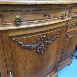 French Oak parquetry top sideboard with a glass top section for displaying and three cupboards and drawers for all your storage needs. Lovely carved details and is in good original detailed condition.