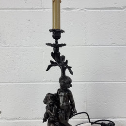 Antique French bronzed metal lamp with cherub's. in very good working original detailed condition.