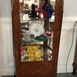 A Louis XV style Kingwood vitrine with marble top. It has beautifully floral inlay with ormolu mounts.