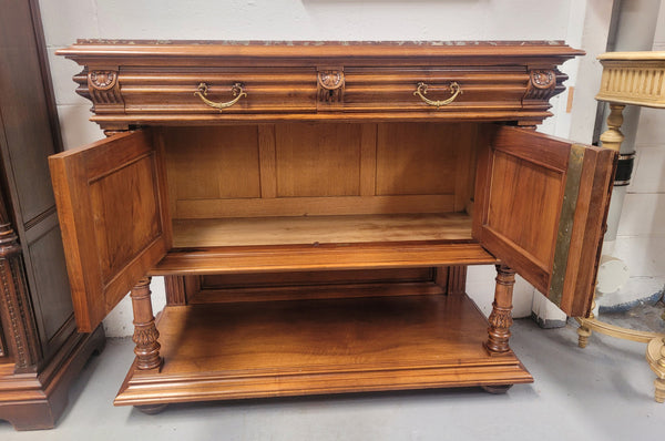 Stunning Henry II style French Walnut marble top buffet. It has a beautiful marble top and plenty of storage with two drawers, two doors with beautiful decorative carvings and an open shelf. It has been sourced from France and is in good original condition and has been detailed to a high standard.