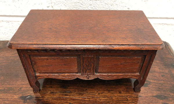 Beautiful Antique oak miniature coffer lined with lovely fabric and would make a fabulous jewellery box . In good condition.