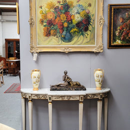 French Louis XVI style painted marble top console table. It is of pleasing narrow proportions and has been sourced from France. It is in good original detailed condition.