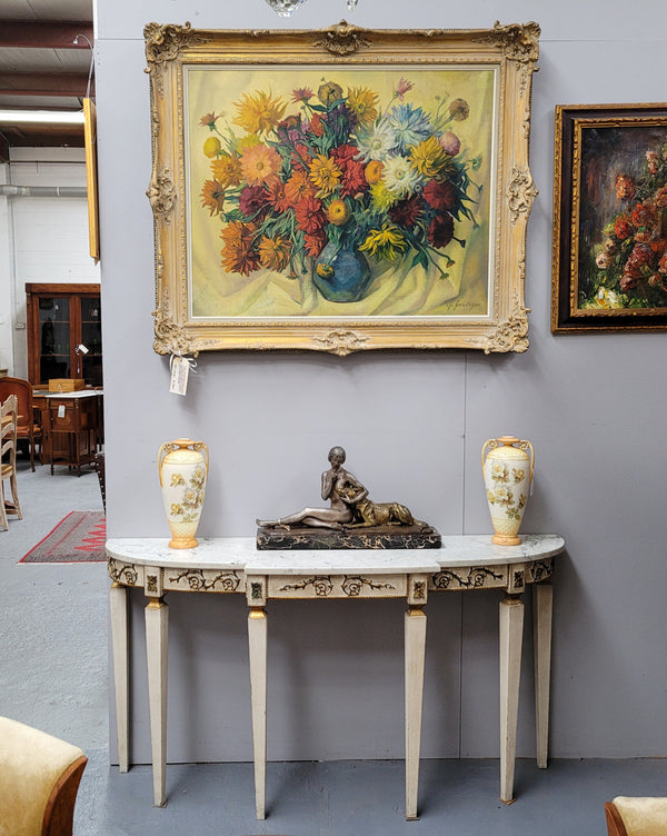 French Louis XVI style painted marble top console table. It is of pleasing narrow proportions and has been sourced from France. It is in good original detailed condition.