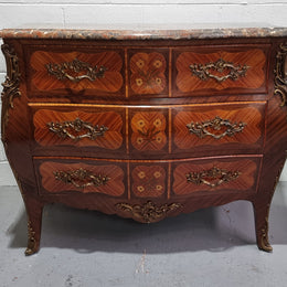 French Walnut and Kingwood Louis XV style marquetry inlaid commode with three drawers and a beautiful marble top. It is in good original detailed condition.