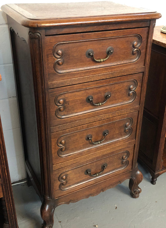 Antique French Oak Louis XV style four drawer bedside cupboard/side cupboard. In good original detailed condition. Circa 1910.
