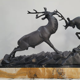 French Art Deco bronzed spelter and marble"Fighting Stags" statue by renowned artist and sculptor "Irenee Rochard".