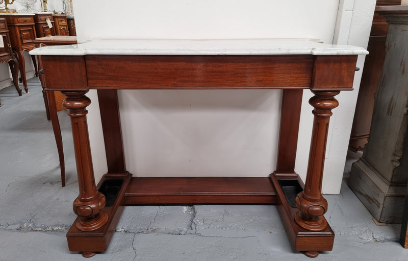 Classic Victorian mahogany console table with white marble top, one drawer and accommodation for sticks/umbrellas. In good original detailed condition.