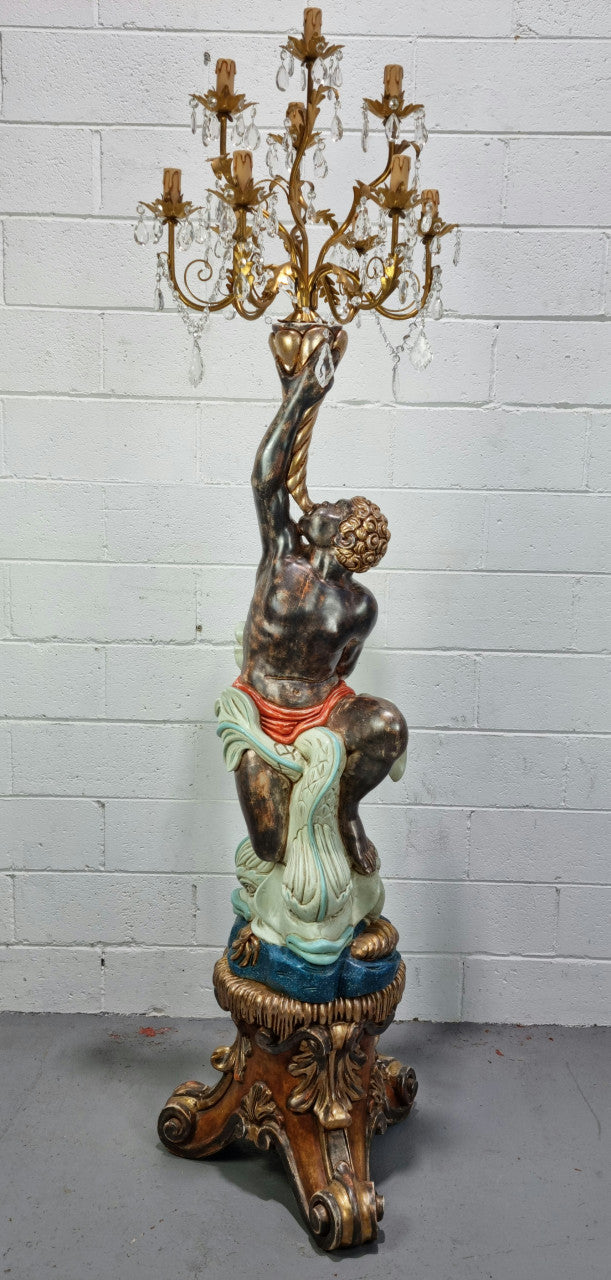 19th Century Italian Wooden Blackamoor lamp sourced in France. Made from carved wood painted & gilded. Amazing detail of a man playing a horn that then turns into a chandelier while riding a mythological sea serpent  It has been fully rewired to Australian standards.