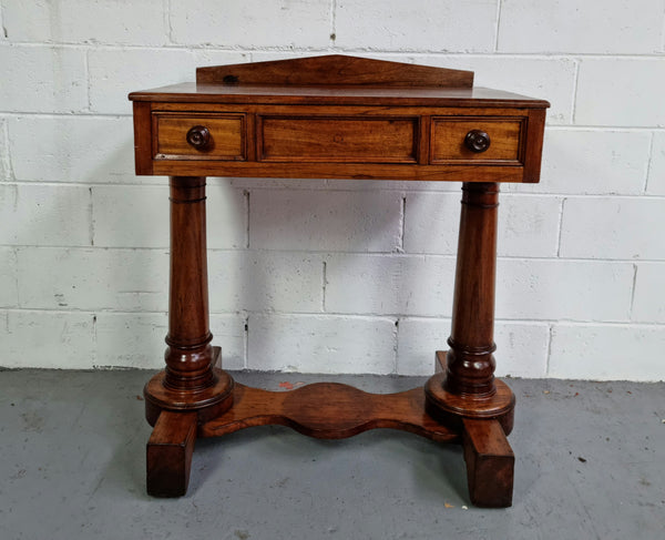 William IV style console table or could be used as a desk. It has two small drawers either side and is ideal for small areas like a unit or apartment. It is very sturdy and is in good original detailed condition.