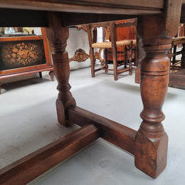 Vintage French Oak stretcher base farmhouse table. It is in good original condition.