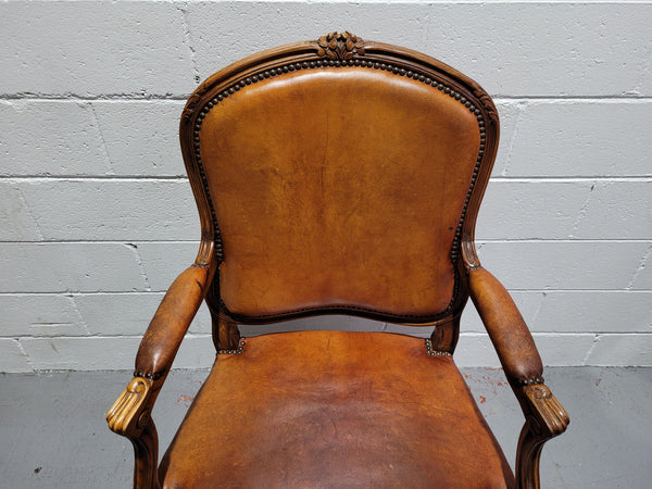 French Walnut Louis XV style desk chair with faux leather upholstery. The upholstery is in good original condition and very comfortable to sit in.