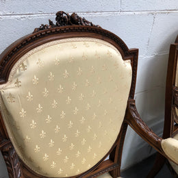 Beautiful pair of Vintage French Walnut Louis XVI style carved Fauteuils with lovely upholstery and wide seats . In good original detailed condition.