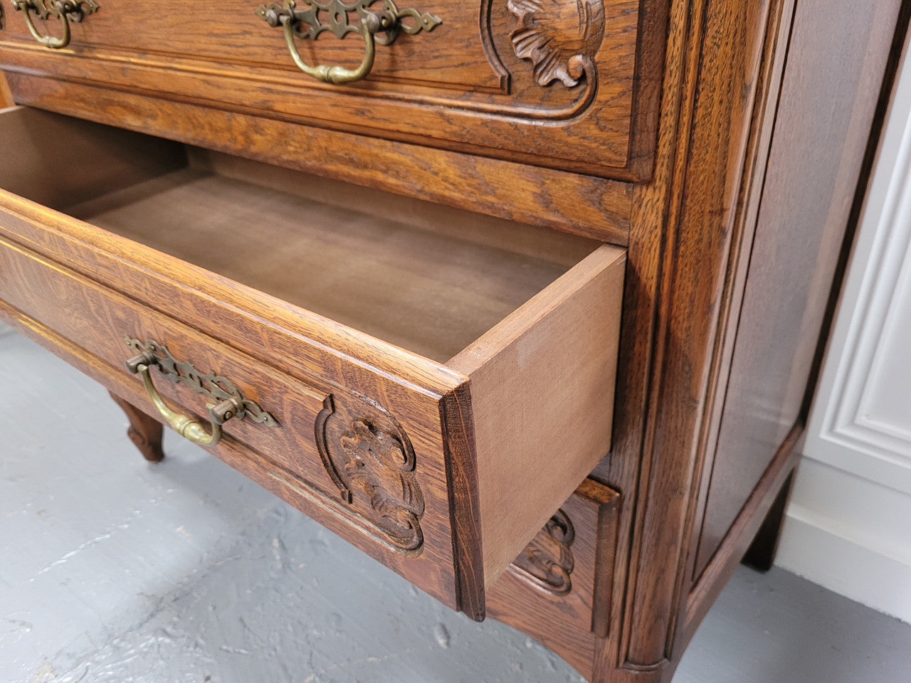 French Louis XV style Oak three drawer chest with wooden top. It has been sourced from France and is in good original detailed condition.