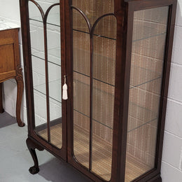 Chippendale style Walnut display cabinet of pleasing narrow portrions. It is in good original condition and comes with three shelves.