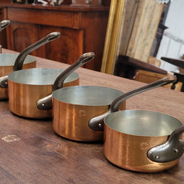 Set of five copper sauce pans with foundry stamp. They have been sourced from France and are in good original detailed condition.
