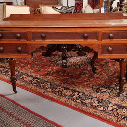 Lovely Victorian Cedar leather tooled  top desk, with five drawers on castors and of pleasing proportions. In very good original detailed condition and has been sourced locally.