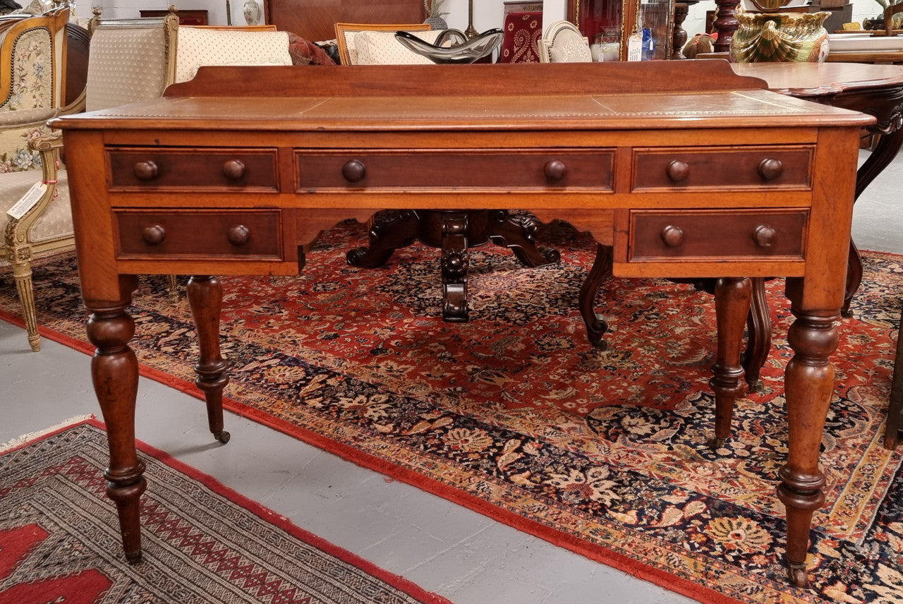 Lovely Victorian Cedar leather tooled  top desk, with five drawers on castors and of pleasing proportions. In very good original detailed condition and has been sourced locally.