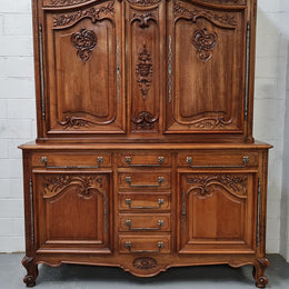 Beautiful 19th century Walnut Louis XV style sideboard with plenty of storage space. The top has two doors that open up to three adjustable shelves. It is in good original detailed condition.