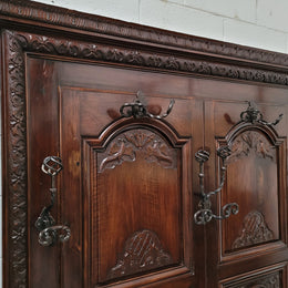 French Henry II 19th century narrow proportioned Walnut hall stand. Full of Character with stunning hand forged wrought iron hooks and interesting carvings. In good original detailed condition.