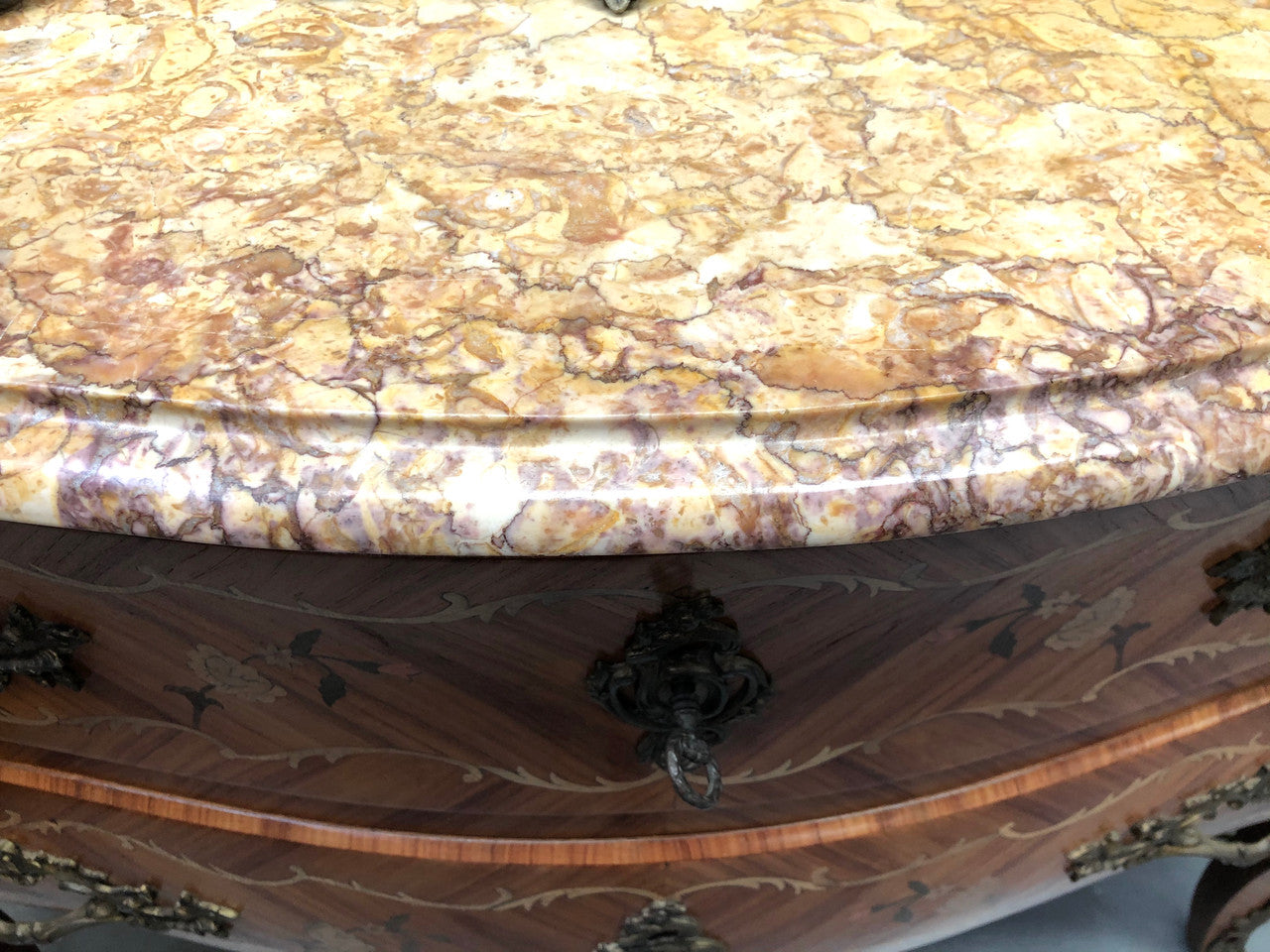 A stunning French 19th century Louis XV style commode with kingwood marquetry inlay. Has beautiful ormolu mounts and marble top.