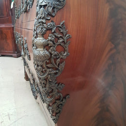 A Grand French Louis XV Style Flame Mahogany Commode