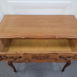 French Oak Louis 15th style nicely carved three drawer wooden top commode. It has been sourced from France and is in good original detailed condition.