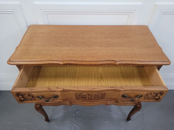 French Oak Louis 15th style nicely carved three drawer wooden top commode. It has been sourced from France and is in good original detailed condition.