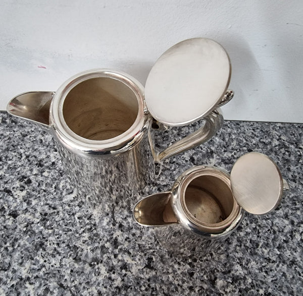Pair of Vintage Silver-Plate water and milk jug. In good condition please view photos as they help form part of the description.