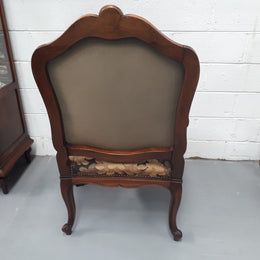 Pair of 19th Century French walnut tapestry covered arm chairs. They are in good original condition. Circa 1890.