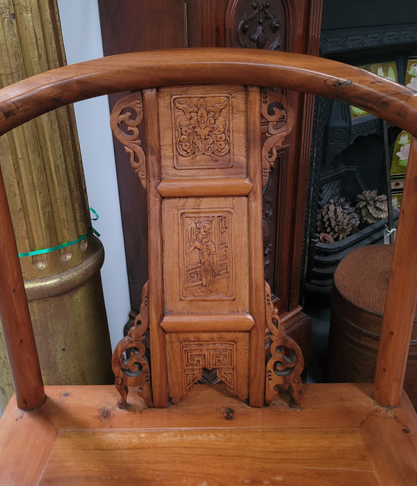 Lovely Chinese Elm horseshoe chair, featuring stunning carving and it is in good original detailed condition.