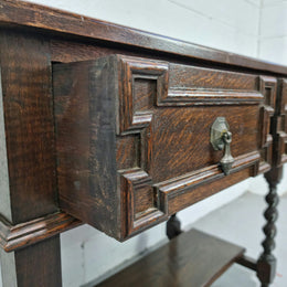 Lovely dark oak small Jacobean style two drawer side cabinet with barly twist legs and lovely carved details. In good original detailed condition.