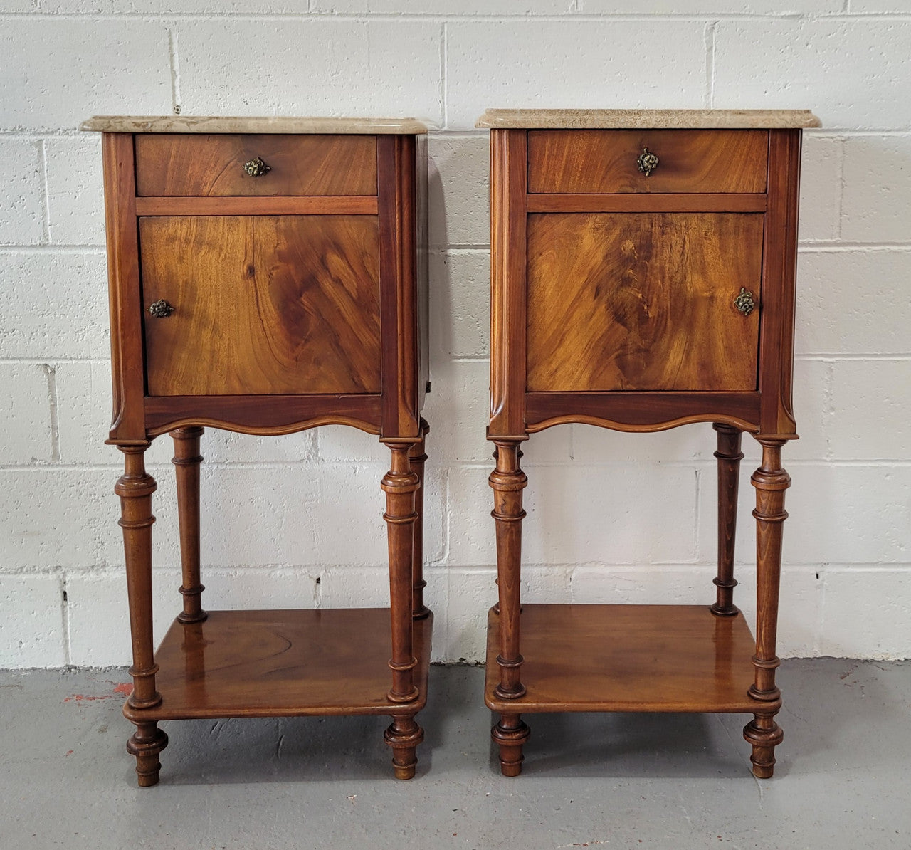Pair of Louis XVI style walnut bedsides with attractive marble. They have one drawer, one cupboard and are in good original detailed condition.