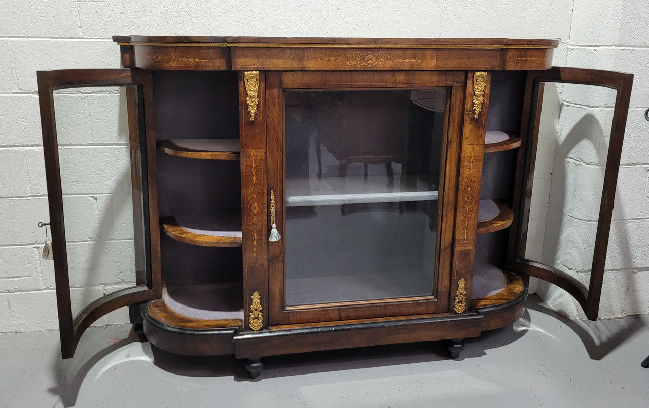 Victorian Rosewood inlaid side cabinet/credenza with velvet lined shelves and gilt mounts. It has been sourced locally and is in good original condition with loads of character.