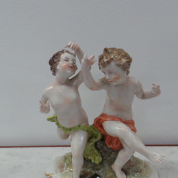 Lovely porcelain 19th century Figurines from the Naples factory. It is in good condition with only slight damage to one finger.