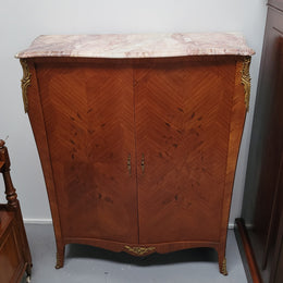 French Louis 15th style Kingwood marquetry inlaid two door cupboard with a beautiful marble top. It has three adjustable shelves and decorative ormolu trim. It has been sourced from France and is in good original detailed condition.